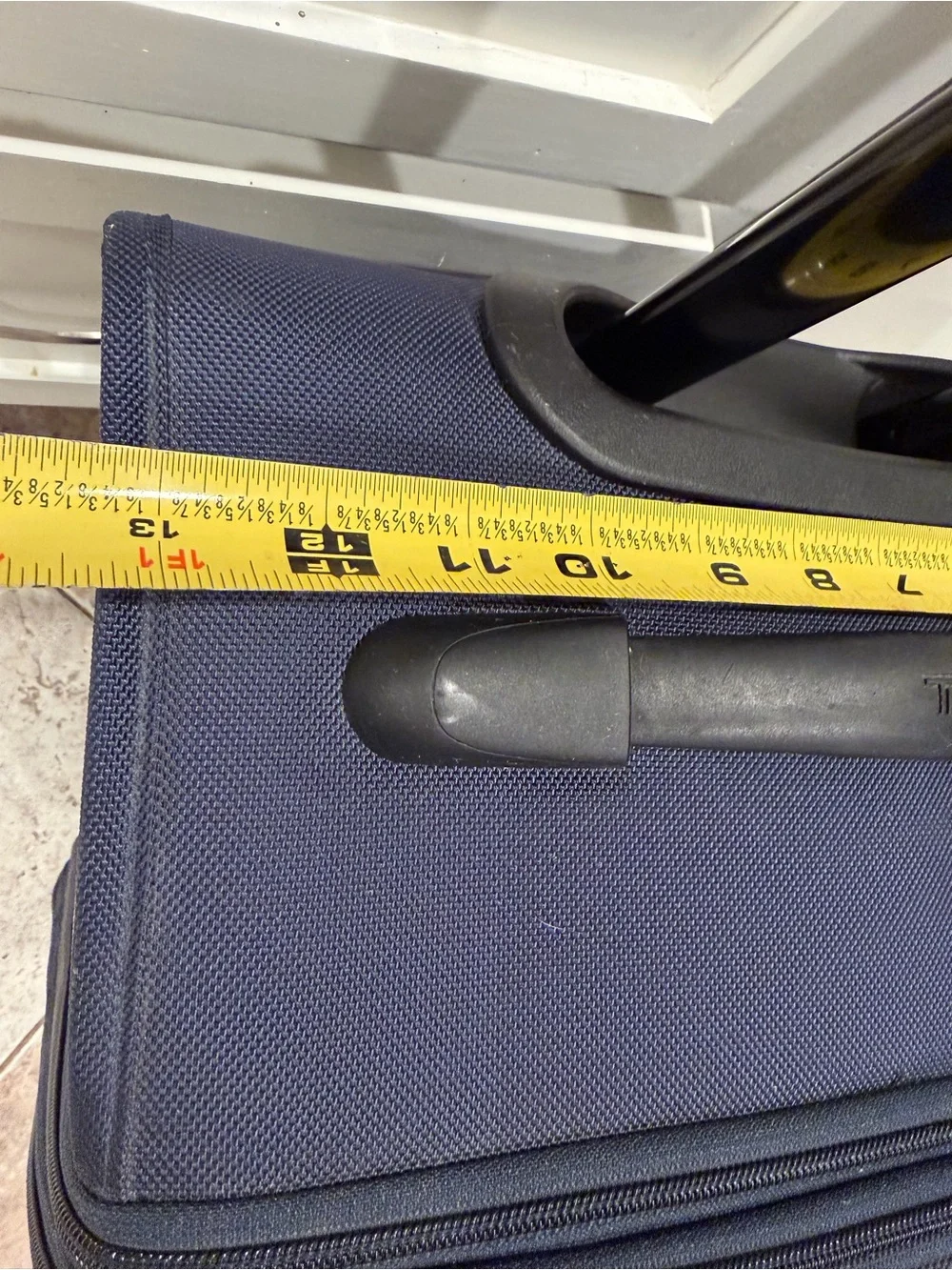 Tumi Navy Softside Carry-On Spinner